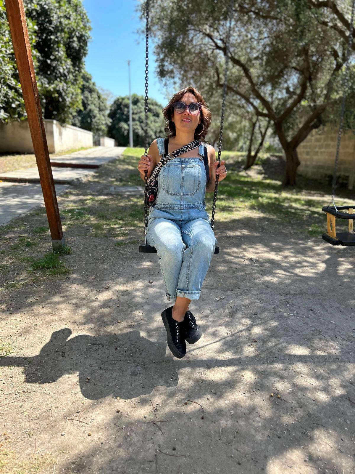 Giulia on a swing in the park
